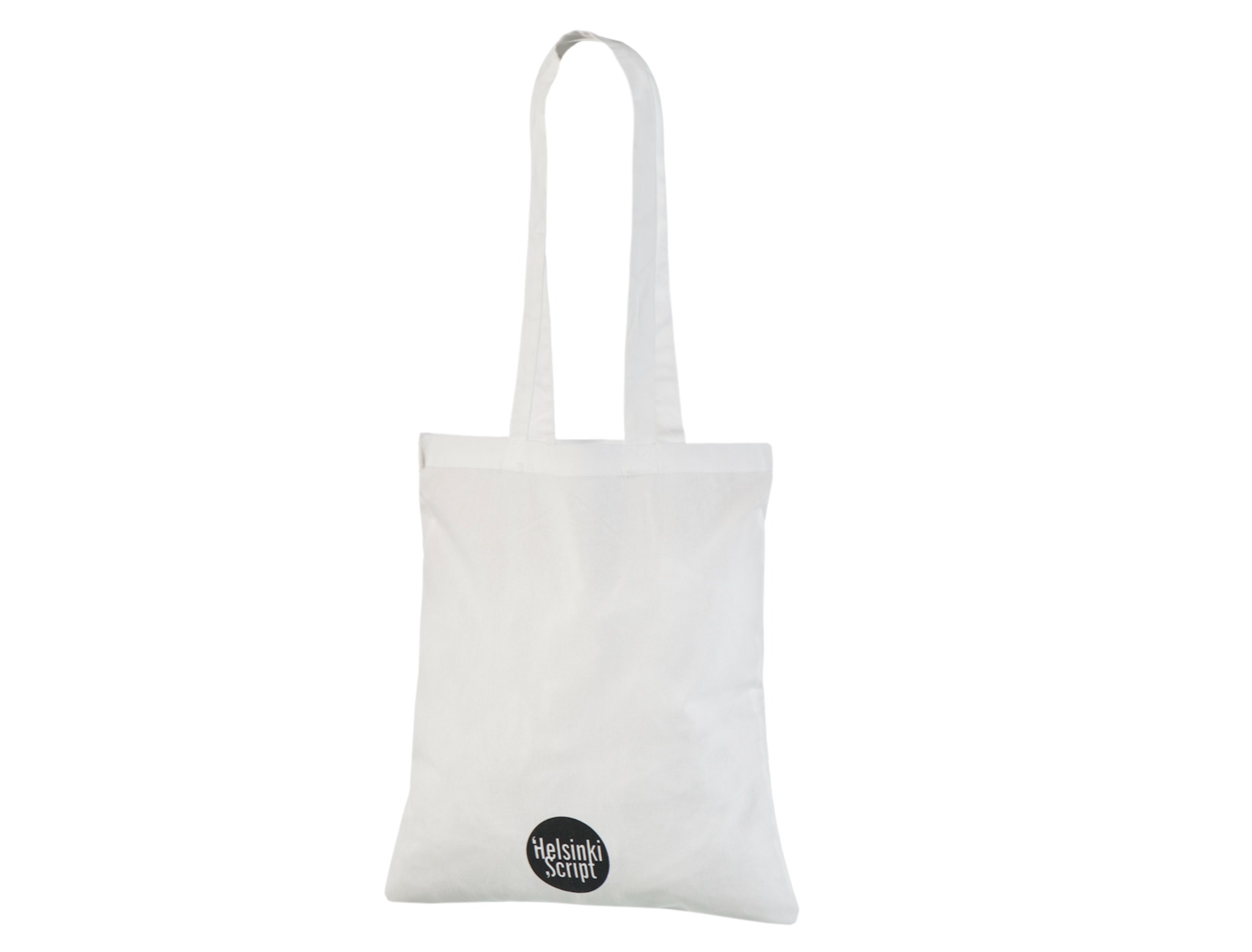 White cotton tote bag with long handles and a small black circular Helsinki Script logo close to the bottom edge.