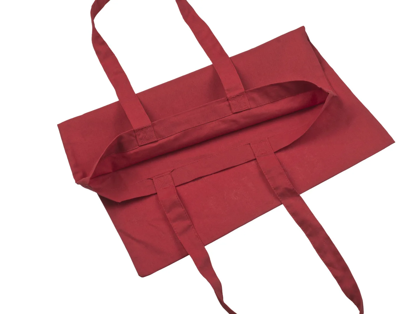 Open inside view of the red 140 g/m² cotton tote bag, showing the inner fabric, upper hem and seams around the bag opening.