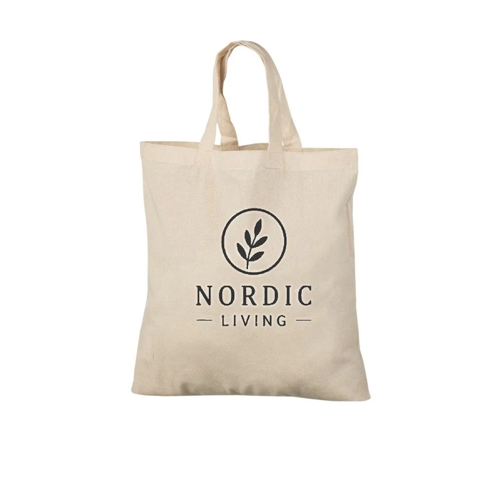 Ejemplo de impresión de logo a un color en la bolsa tote de algodón natural de 140 g/m², que muestra el diseño de muestra en la bolsa.