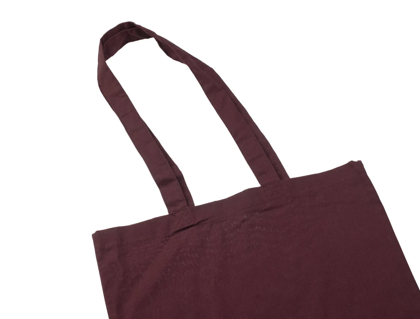 Bordo 140 g/m² medžiaginio maišelio iš medvilnės rankenų stambus planas, kuriame matyti audinio juostos, siuvimo siūlės ir tvirtinimas prie maišelio.