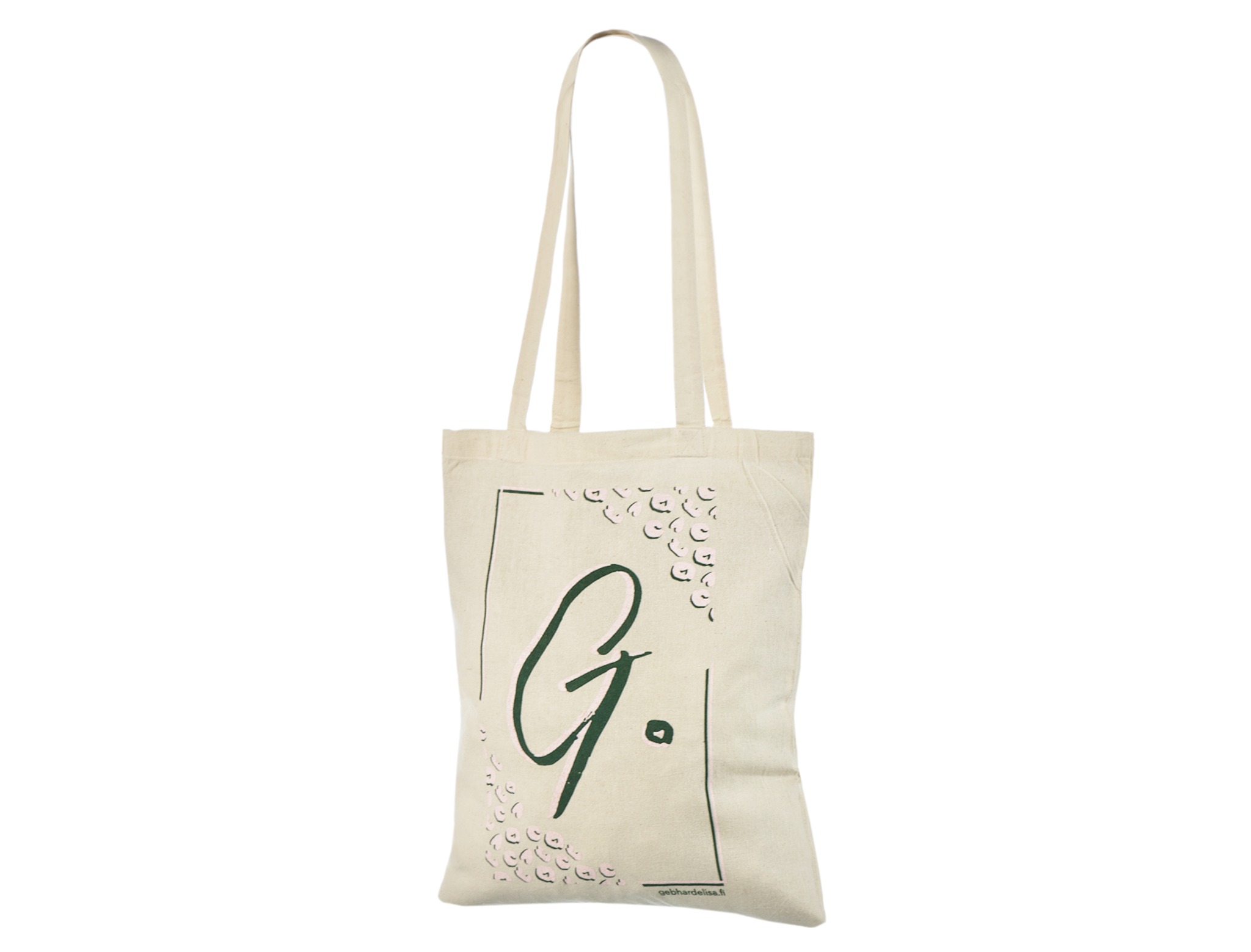 Naturel katoenen tas bedrukt met de tekst gebhardelisa.fi, een fijn kader, kleine herhaalde motieven, lichtroze details en een grote groene G.